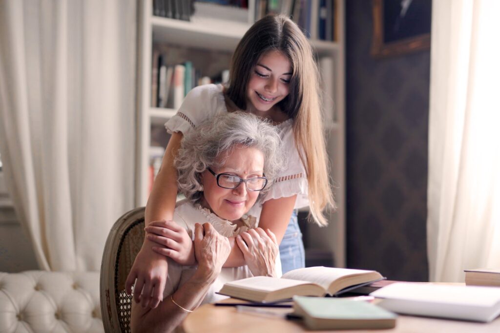 photo of woman embracing her grandmother. Best nonfiction books for Global Intergenerational Week