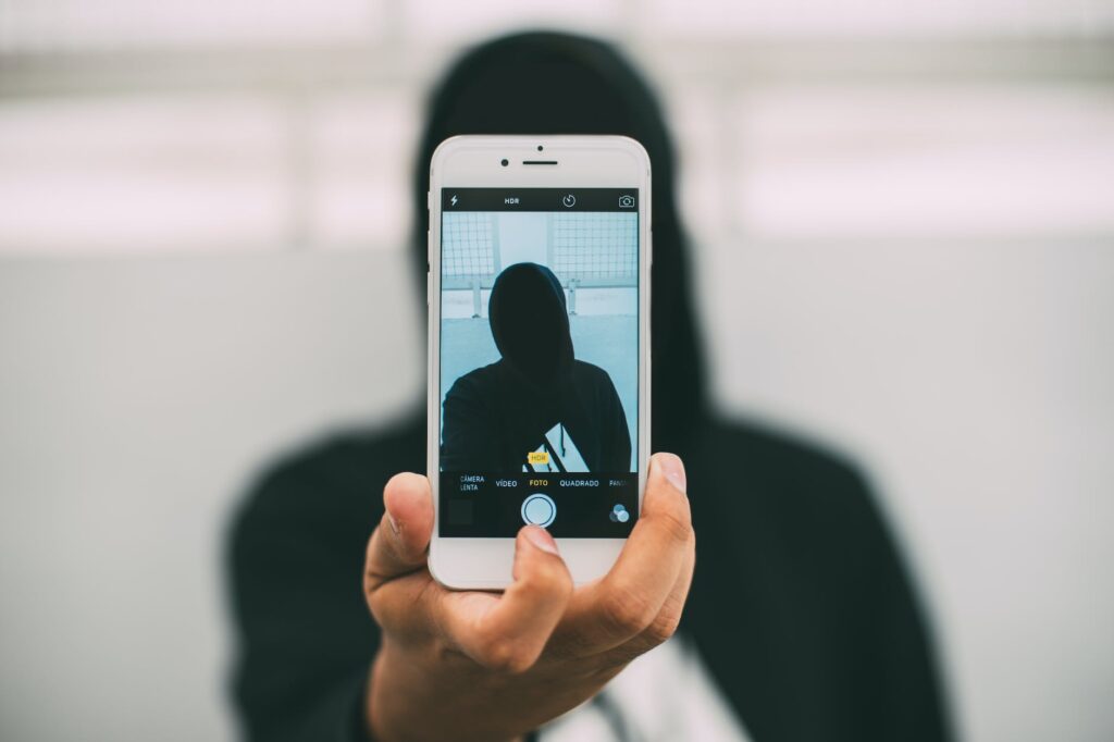 person taking a photo using iphone