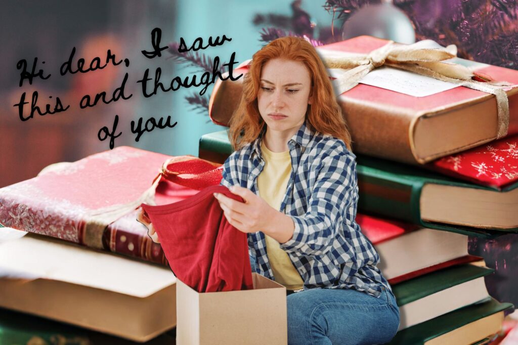 Regifting books shows red haired woman scornfully looking at red top, while sitting on a pile of giant regifted books wrapped up and the text "Hi dear, I saw this and thought of you" in the background