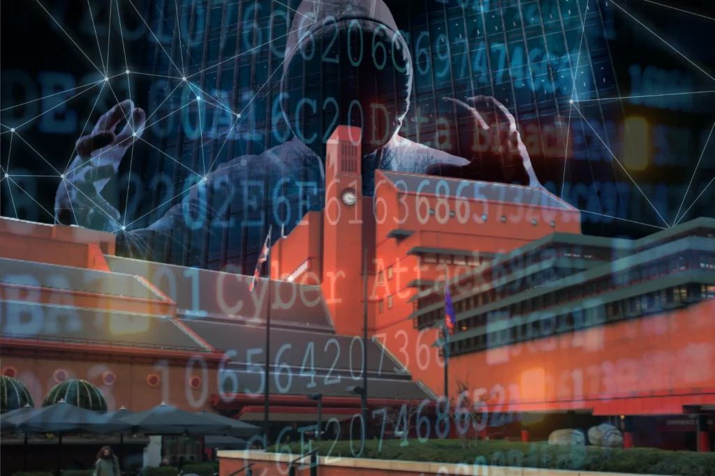 British Library battles ongoing cyber-attack fallout. Blue image of hooded cyber attacker and algorithm numbers on top of British Library building