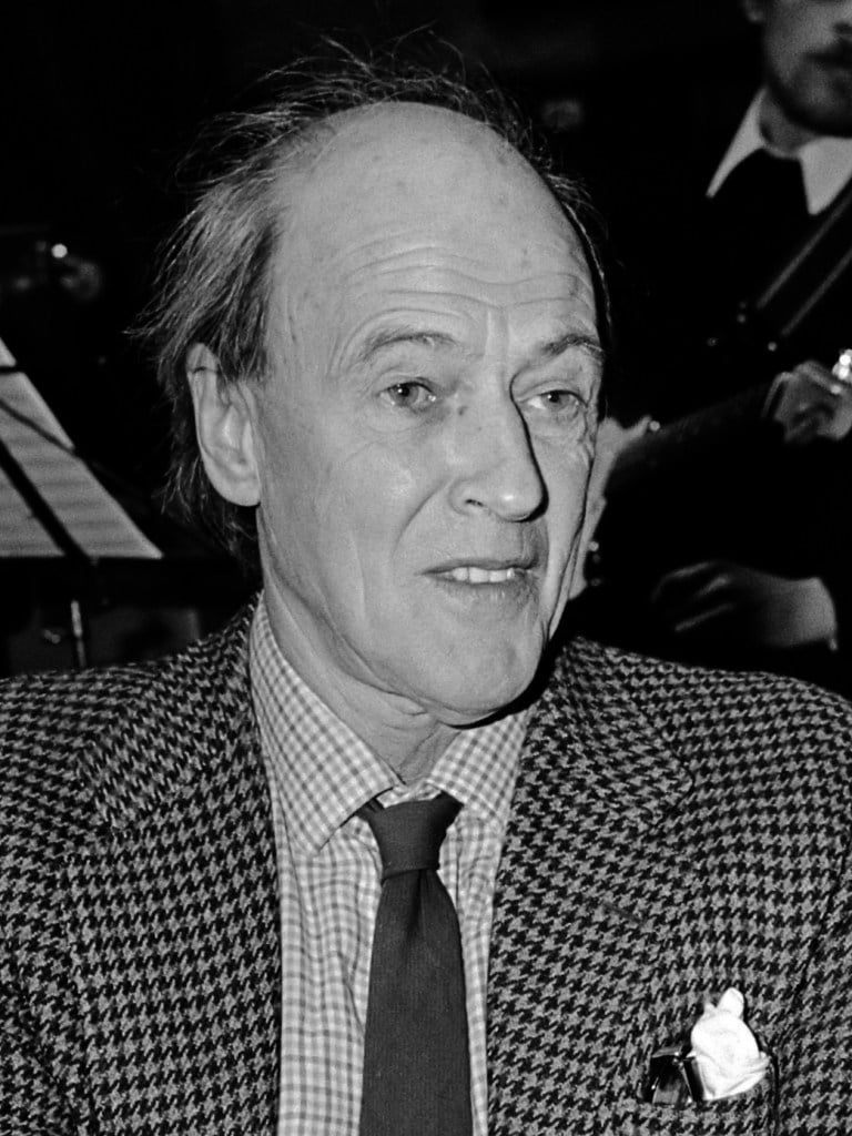 Roald Dahl black and white image with checked blazer, is one of the authors whose books are being rewritten