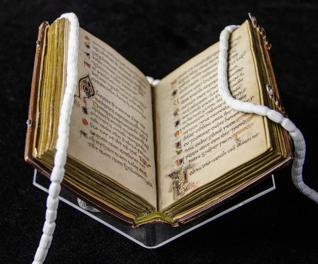 Full view of the Celtic Psalter open on a glass stand - World's oldest book
